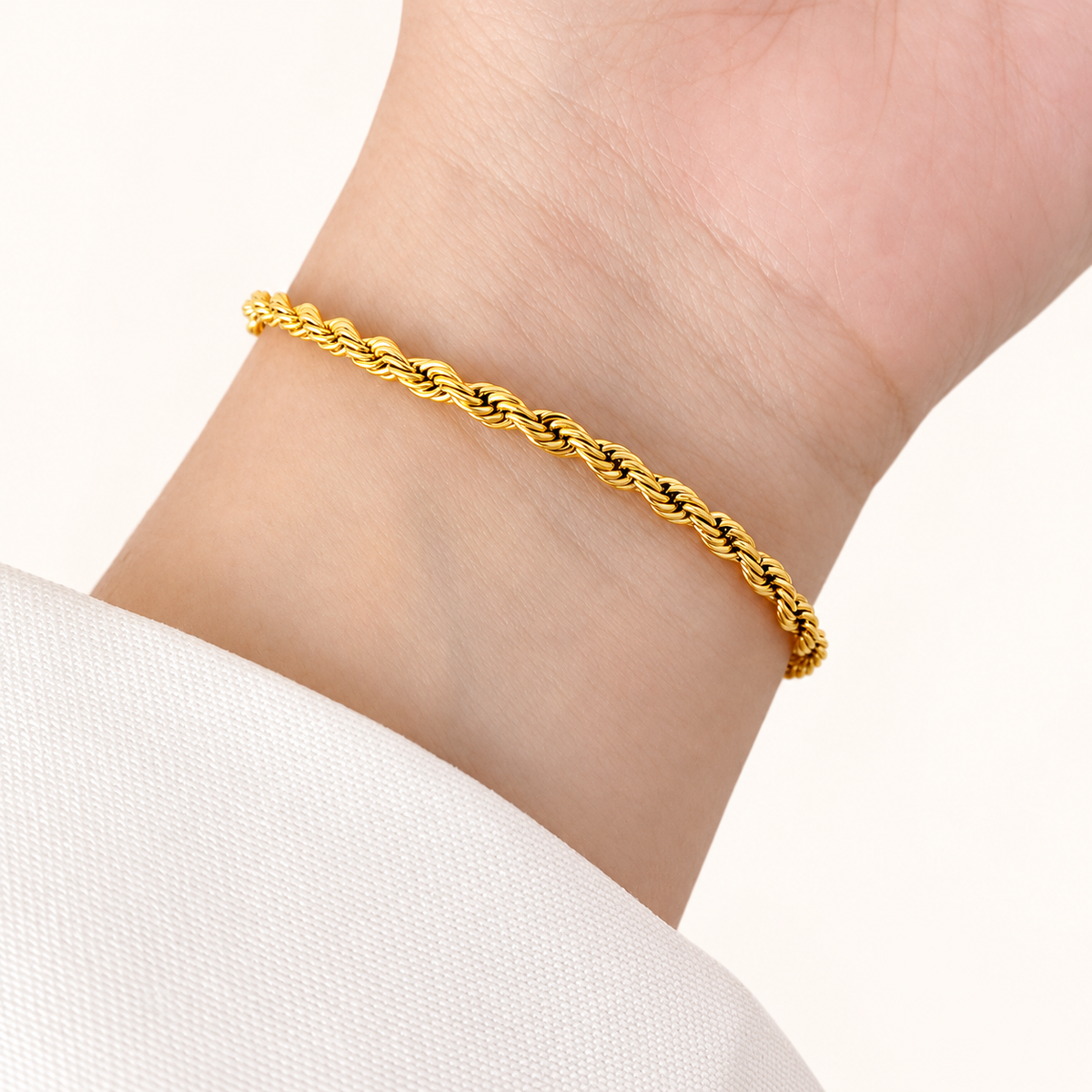 Golden rope chain bracelet on wrist